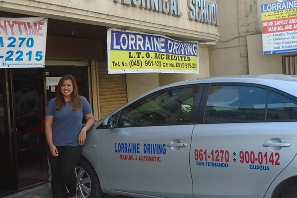 A Lorraine Driving School training vehicle parked in front of their main office lorraine driving school in san fernando pampanga