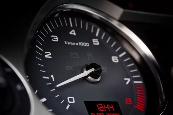 A picture of a car's tachometer.