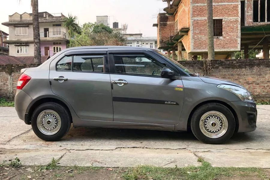 A picture of a Dzire with lowering springs