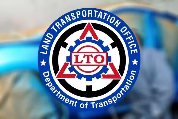The LTO logo with a blurred man painting a car at the back