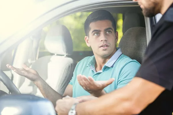 Studies show that more men are being penalized and pulled over by traffic police than women. man get ticket