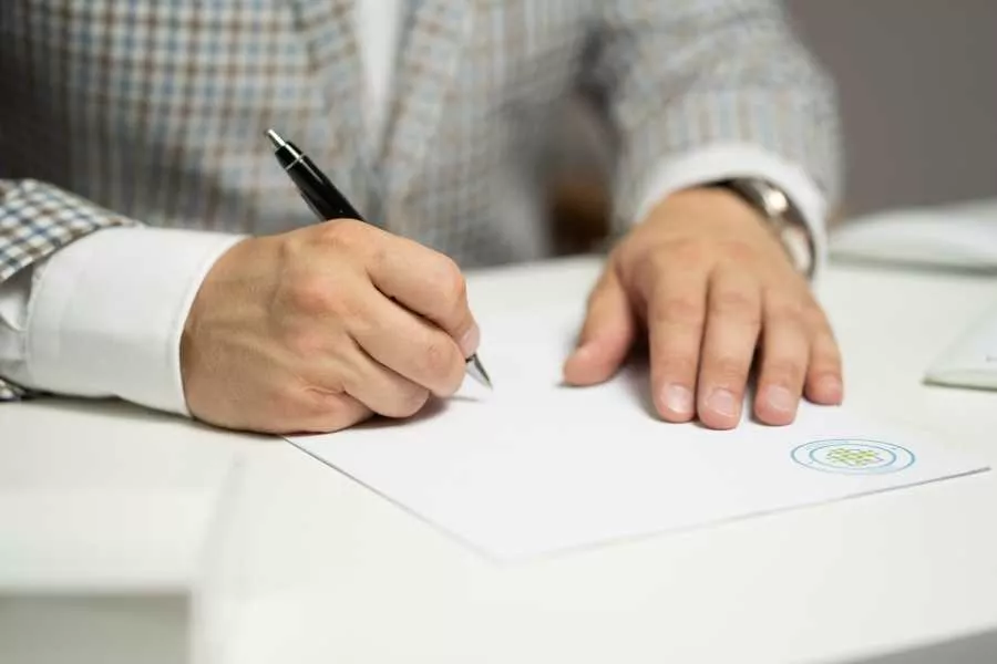 Man signing paper