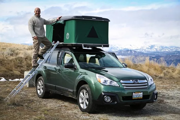 man with car camping tent