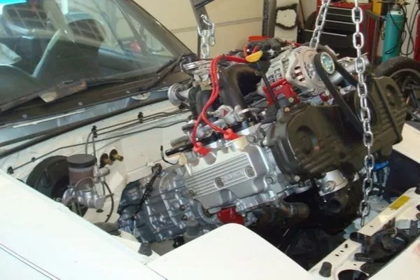 Despite the kit, this doesn't look easy at all. A picture of a flat-four being installed on an MX-5 Miata