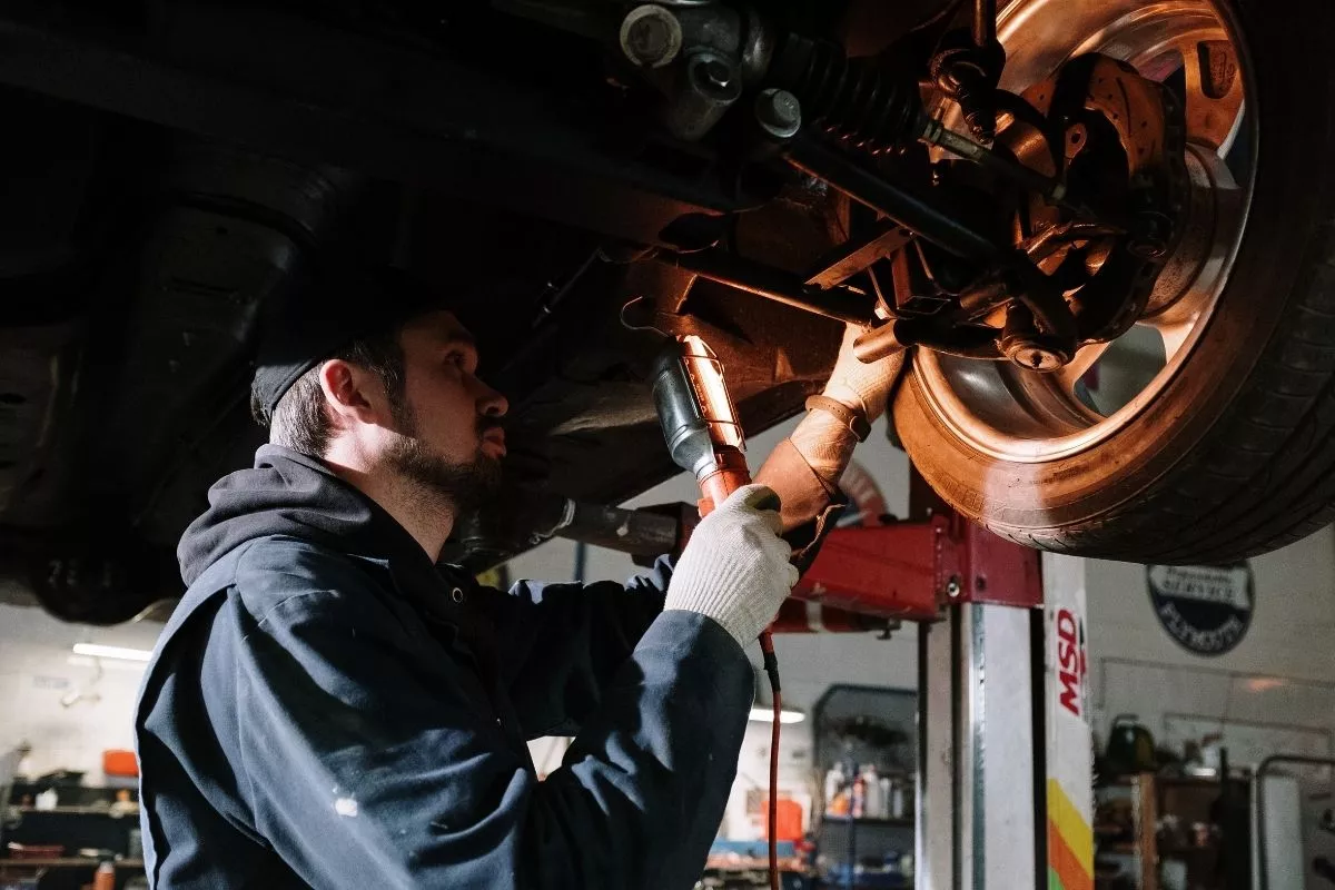 A man inspecting a car