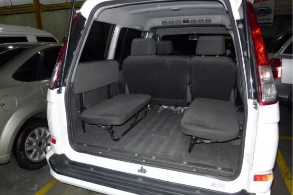 A picture of the Mitsubishi Adventure's interior viewed from the rear.