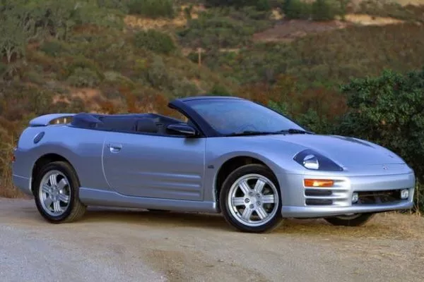 A picture of a Mitsubishi Eclipse parked near a cliff