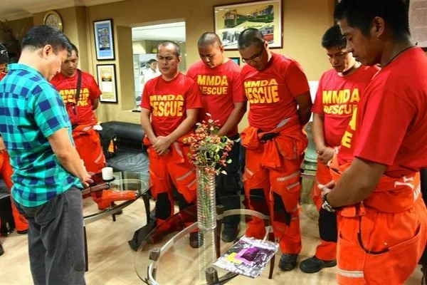 The MMDA Rescue team is one of the most active units in Metro Manila MMDA Rescue team members in prayer