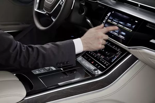 Man touching the infotainment system