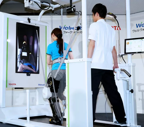 two engineers testing a rehabilitation robot