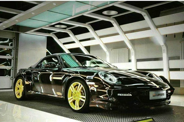 This paint treatment for a car is a liquid coating that is applied that has a glossy look car with nano ceramic coats