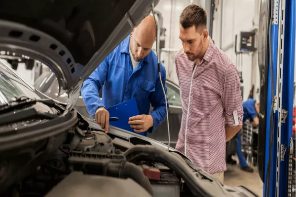 mechanic inspecting a car