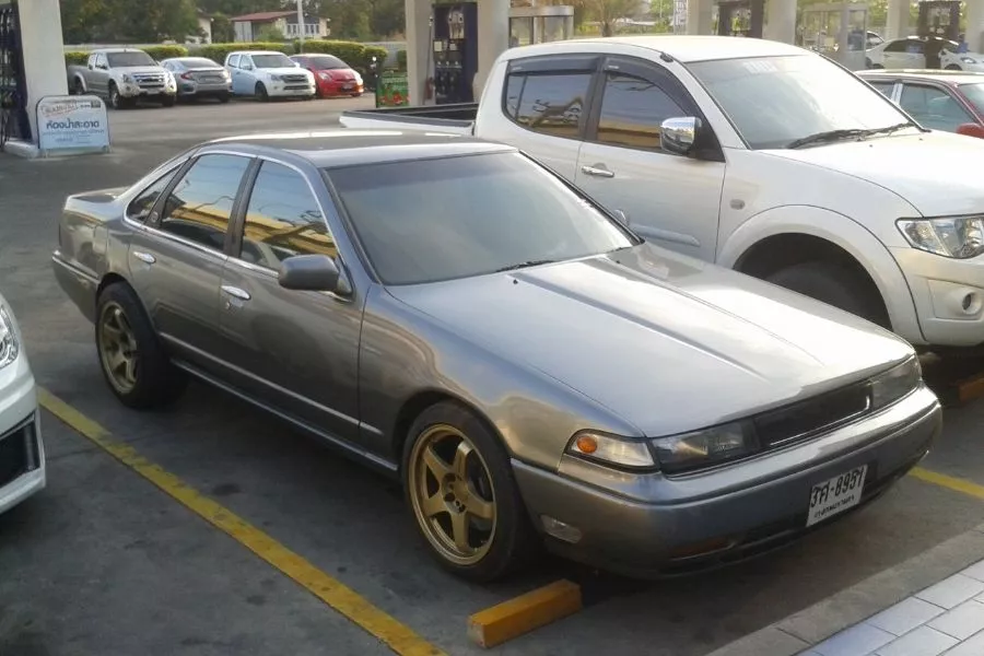 A picture of a Nissan Cefiro A31 parked somewhere in Thailand