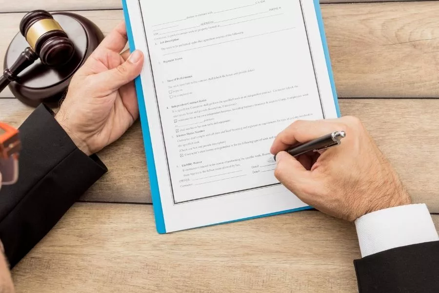 A picture of a notary signing a paper