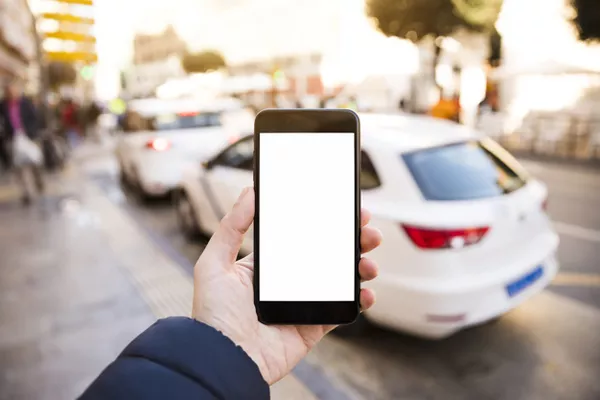 Proximity is still important when pairing the devices Man holding a phone