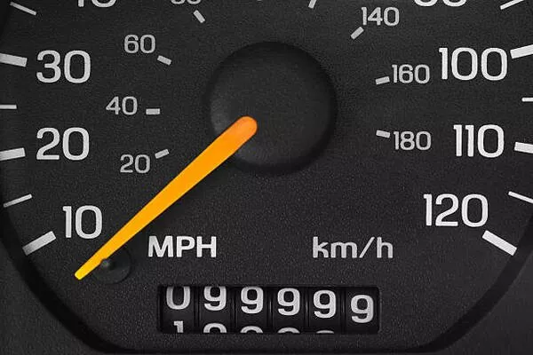 A black analog mileage of a car