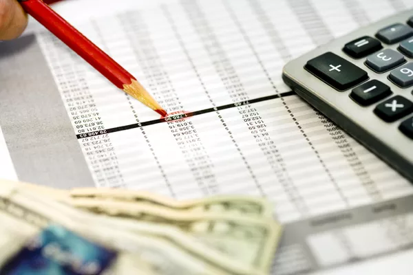 calculator and red pencil