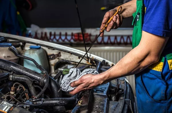 Mechanic changing oil 