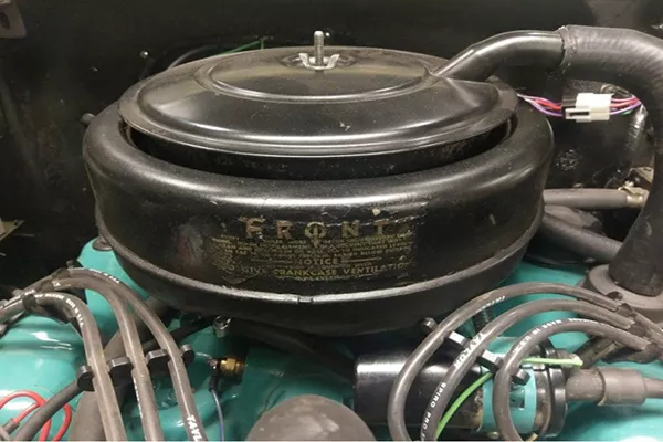 A closeup shot of an old, round shaped oil bath filter