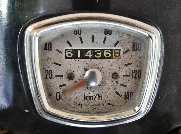 A white analog mileage