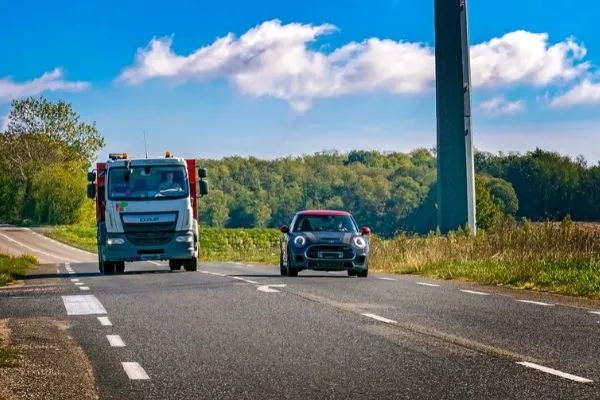 Stalled or left-turning vehicles on the leftmost lane are also valid reasons to overtake on the right overtaking truck