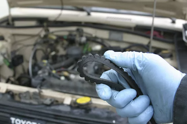 Man holding a car rubber component