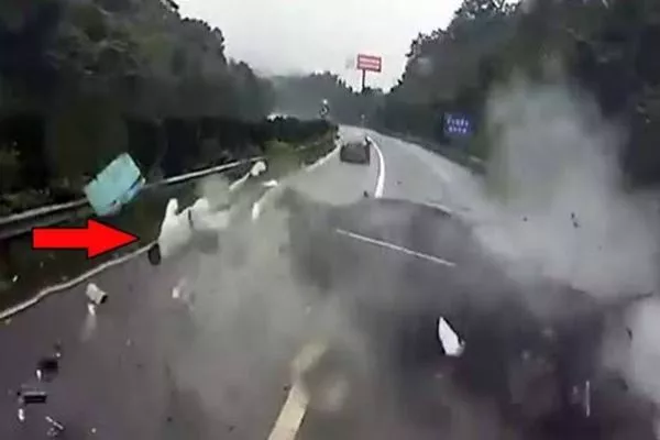 A picture of a passenger being thrown out of his car due to a crash.