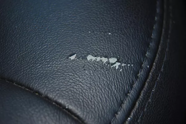 Another effect of our sweat's acidity on leather is peeling peeling off leather