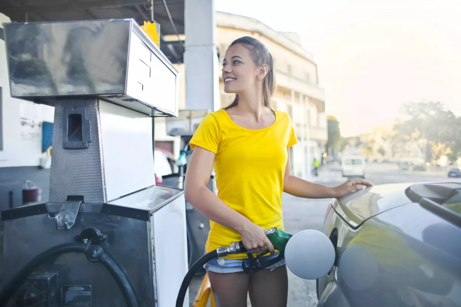 Girl filling up with fuel 