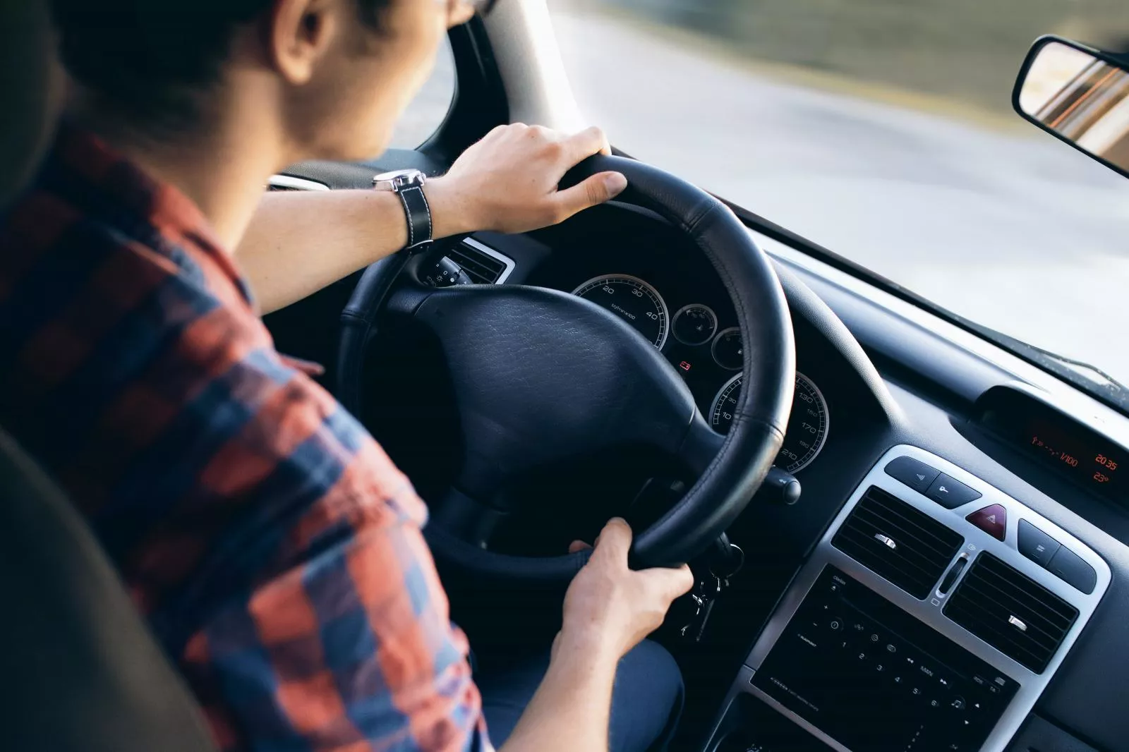 Man holding a steering wheel