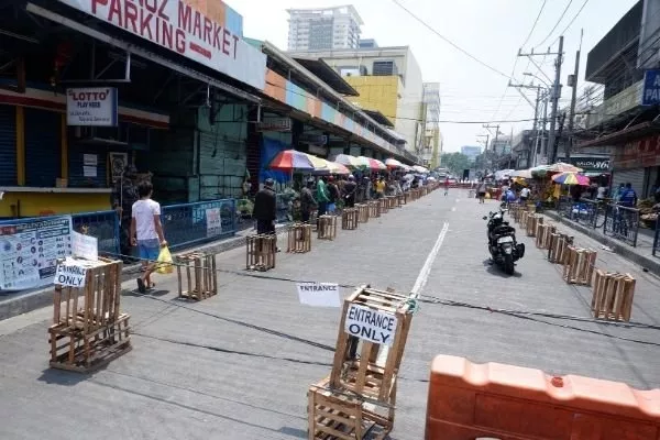 Always double check your quarantine pass before leaving your home A market in the Philippines