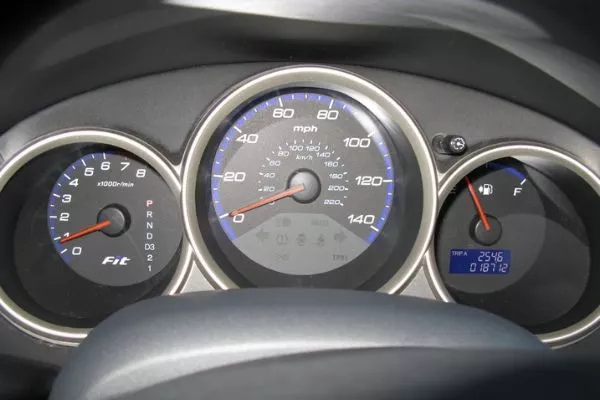 A picture of a Honda Jazz's gauge cluster showing it's mileage