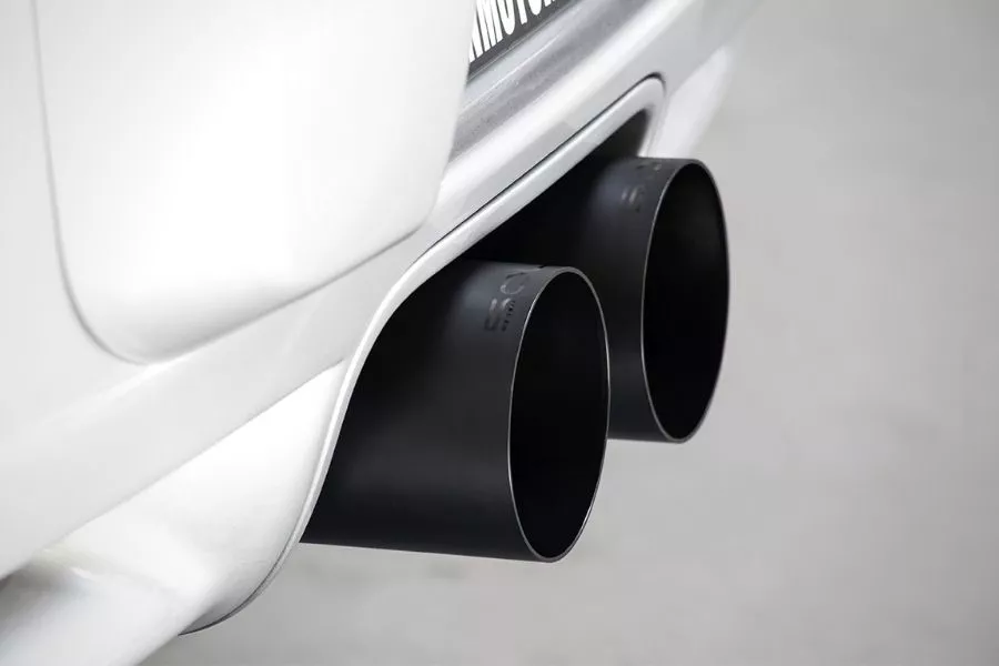 A picture of a Porsche Cayman's aftermarket exhaust outlets