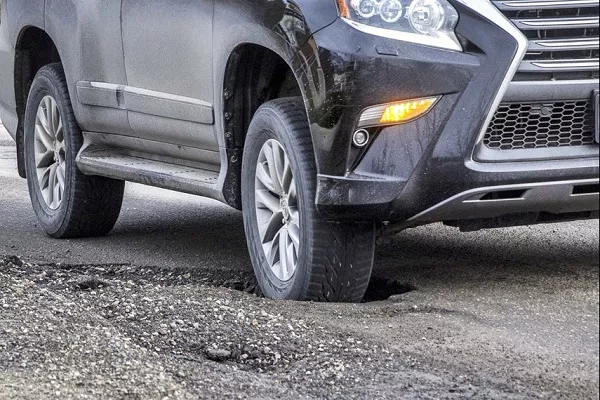 driving on potholes