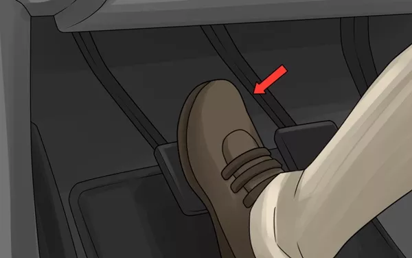 To start a manual transmission car, use your left foot to press the clutch pedal down to the floorboard press the clutch pedal