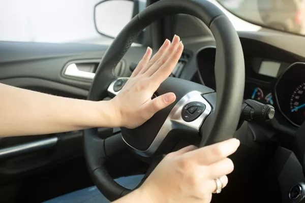 hand on car horn
