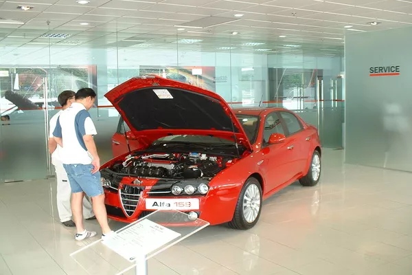 Your recall notice will most likely contain the contact details of your dealership’s service manager Two person and a red car