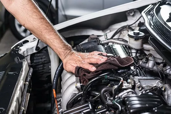 Man cleaning the engine