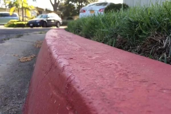 A picture of a curb colored in red