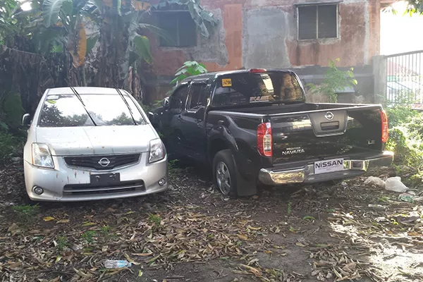 A picture of an open air repossessed car lot