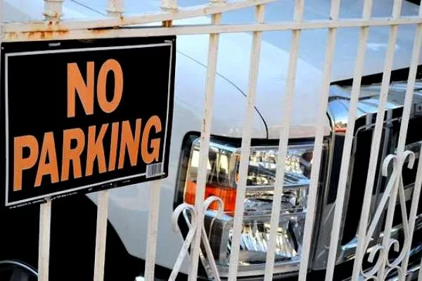 Car behind gate in a residence
