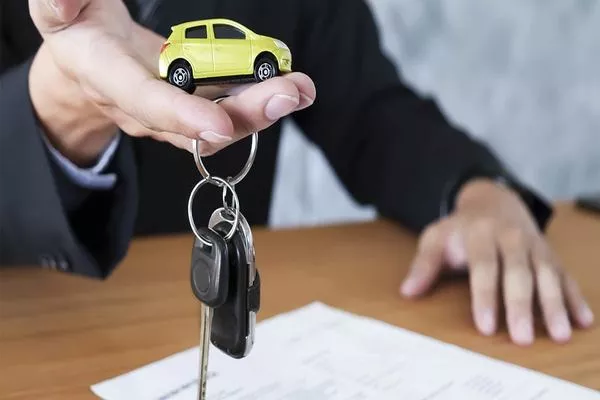Man offering car keys