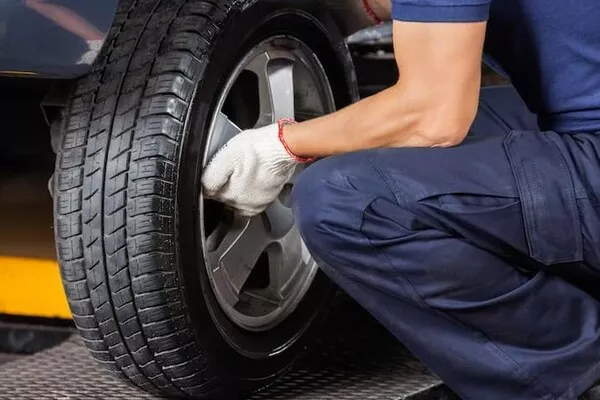 Car tires being checked