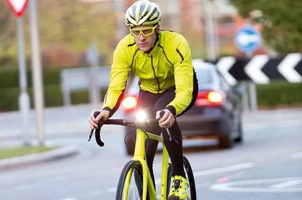 To protect yourself, you should make sure that other drivers can see you by wearing bright-colored cloths Cyclist wearing yellow clothing