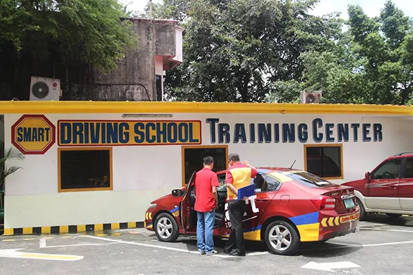 One of Smart Driving School's training centers which has its own driving track A picture of Smart Driving School's training center and their training cars