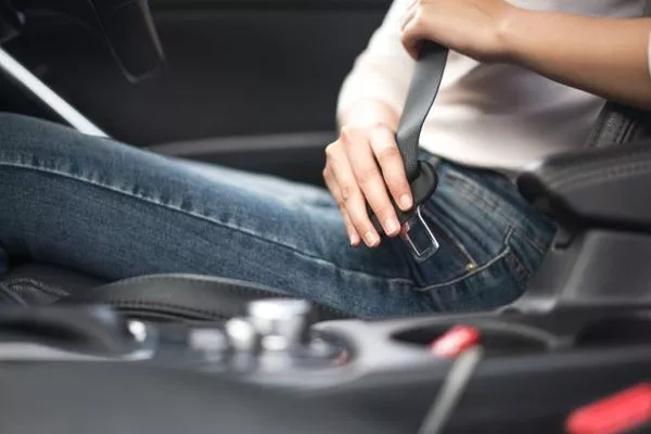 Woman wearing seatbelts