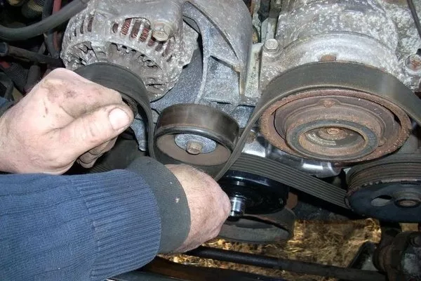 An engine with an accessory drive belt