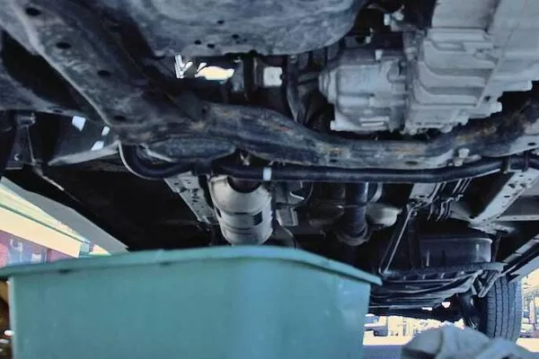 car parts under a car