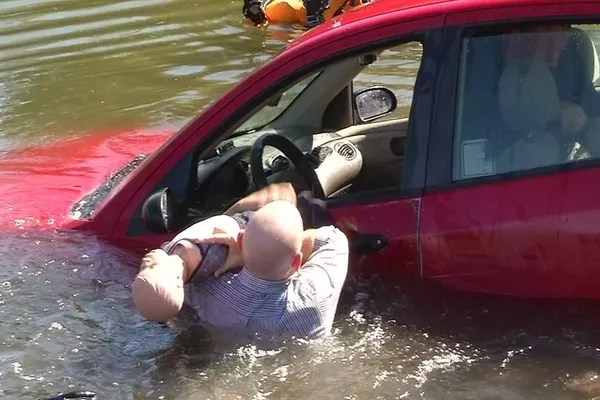 Man saving a kid from a sinking ship