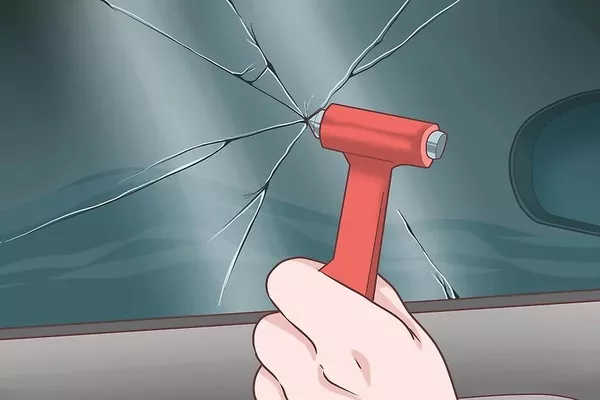 Man breaking the window